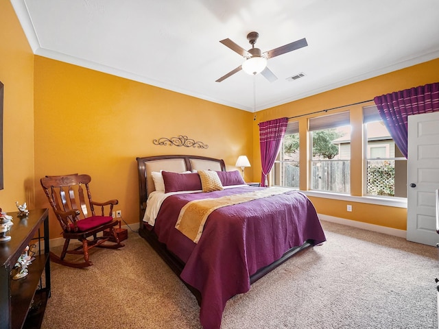 bedroom featuring crown molding, ceiling fan, and carpet flooring