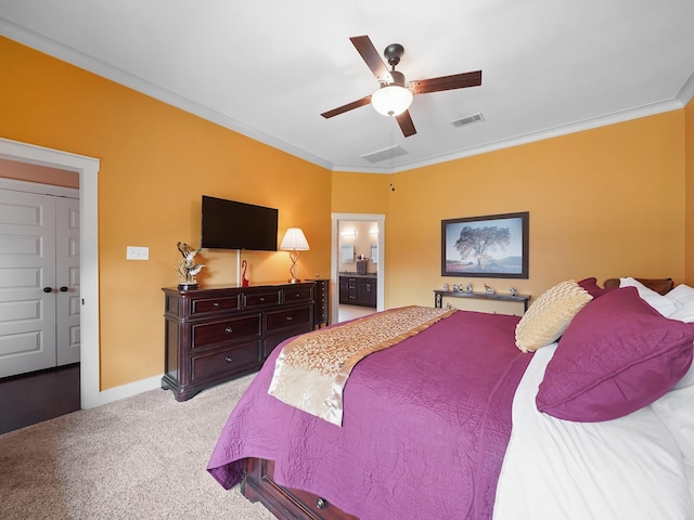 carpeted bedroom featuring ceiling fan, ornamental molding, and connected bathroom