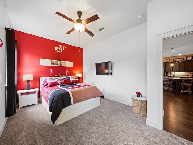 carpeted bedroom with ceiling fan