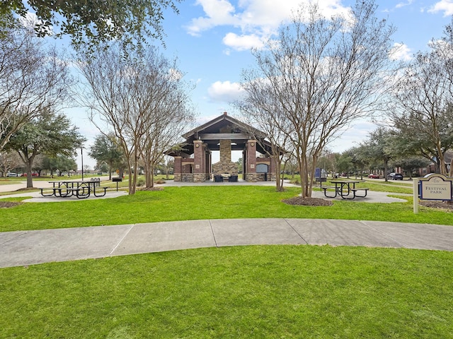 surrounding community with a yard and a gazebo