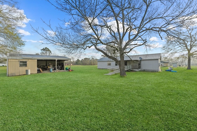 view of yard with an outbuilding and a pole building