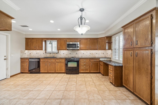 kitchen featuring sink, crown molding, backsplash, black appliances, and decorative light fixtures