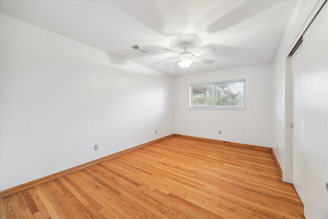 empty room featuring ceiling fan and light wood-type flooring