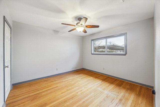 unfurnished room featuring ceiling fan and light wood-type flooring