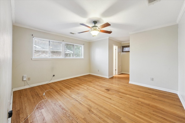 spare room with crown molding, ceiling fan, and light hardwood / wood-style flooring