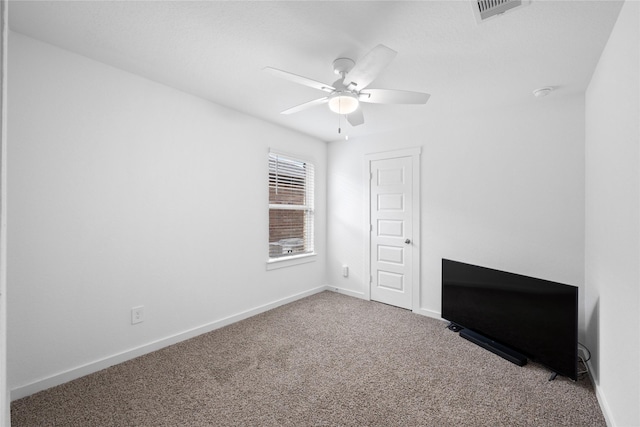 unfurnished bedroom with ceiling fan and carpet