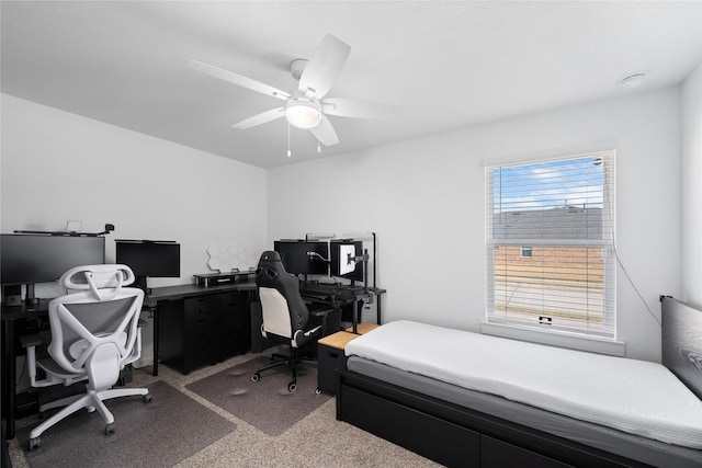 bedroom featuring ceiling fan and carpet