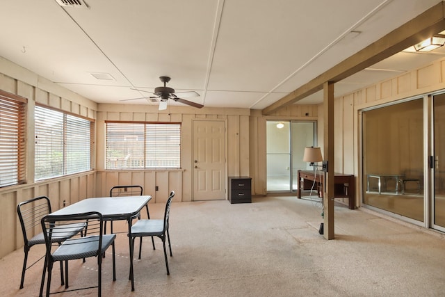 sunroom / solarium featuring ceiling fan