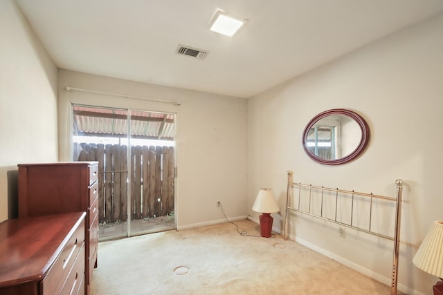 unfurnished room featuring light colored carpet