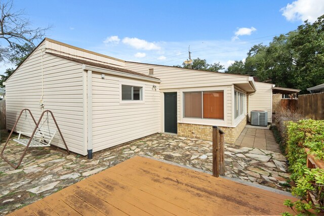 rear view of property with a patio, central AC, and a deck