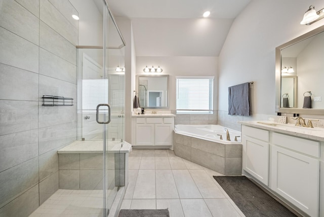 bathroom with tile patterned flooring, plus walk in shower, lofted ceiling, and vanity