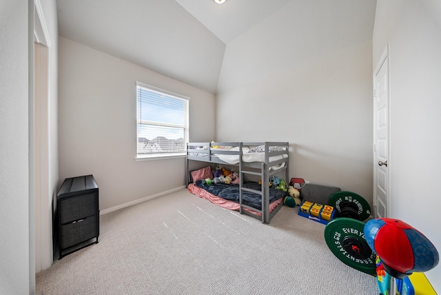 bedroom featuring lofted ceiling and carpet flooring