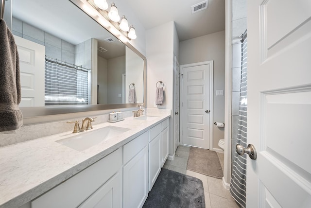 bathroom with tile patterned flooring, vanity, toilet, and a shower with shower curtain