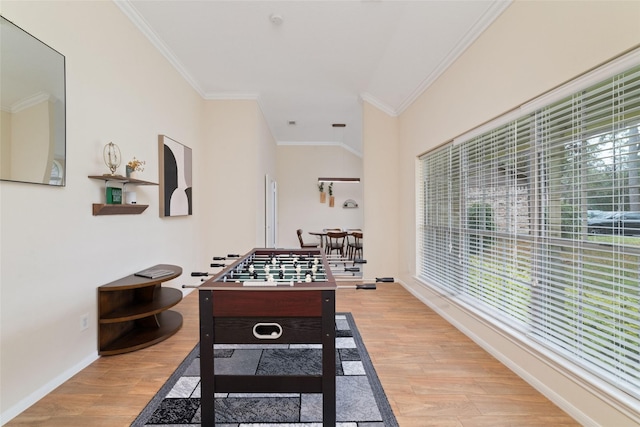 playroom featuring crown molding and light hardwood / wood-style floors