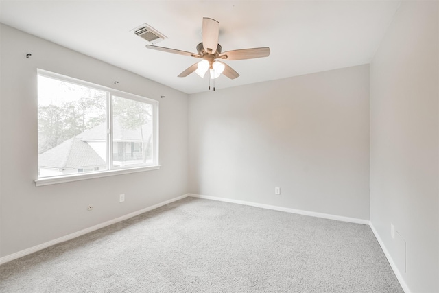 carpeted empty room with ceiling fan