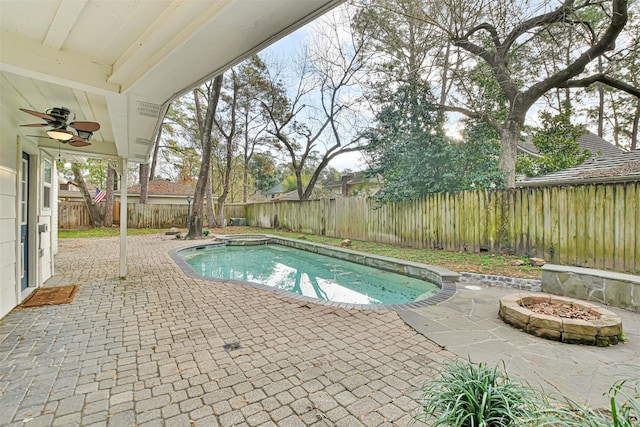 view of swimming pool with ceiling fan and a patio area