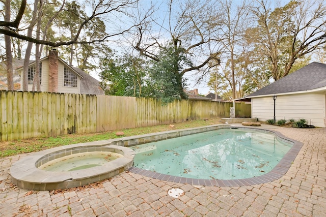 view of pool featuring an in ground hot tub and a patio