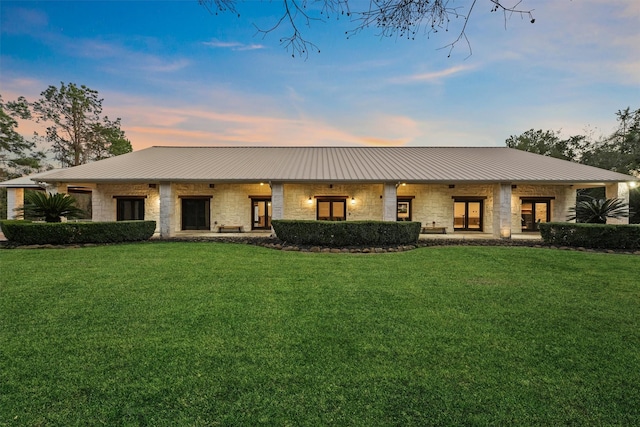 view of front of property with a yard