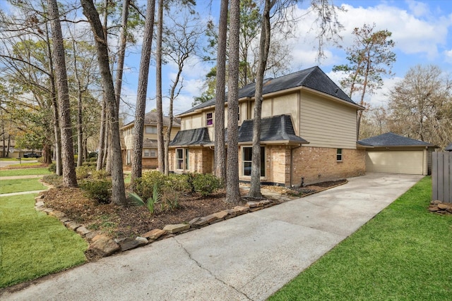 view of front of property with a garage, a yard, and brick siding