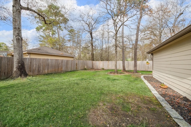 view of yard with a fenced backyard