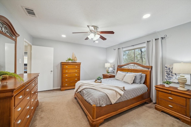 bedroom featuring visible vents, light colored carpet, ceiling fan, a textured ceiling, and recessed lighting