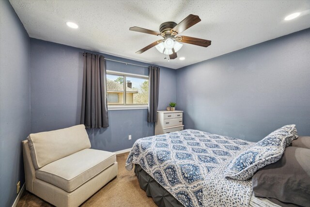 bedroom featuring ceiling fan, a textured ceiling, recessed lighting, carpet flooring, and baseboards