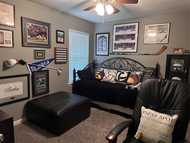 carpeted bedroom featuring ceiling fan and multiple windows