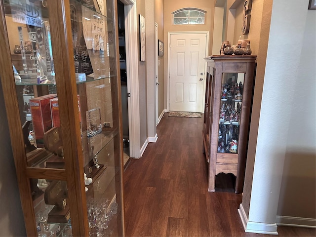 corridor featuring dark wood-type flooring