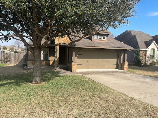 view of front of house with a garage and a front lawn