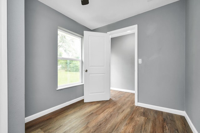 spare room featuring dark hardwood / wood-style floors