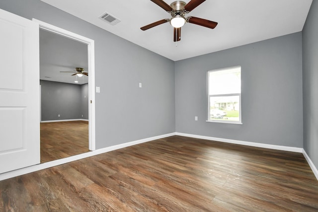 unfurnished bedroom with ceiling fan and wood-type flooring