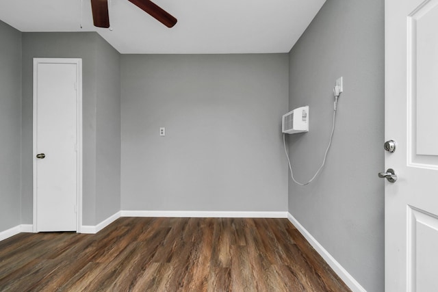 unfurnished room featuring ceiling fan and dark hardwood / wood-style floors