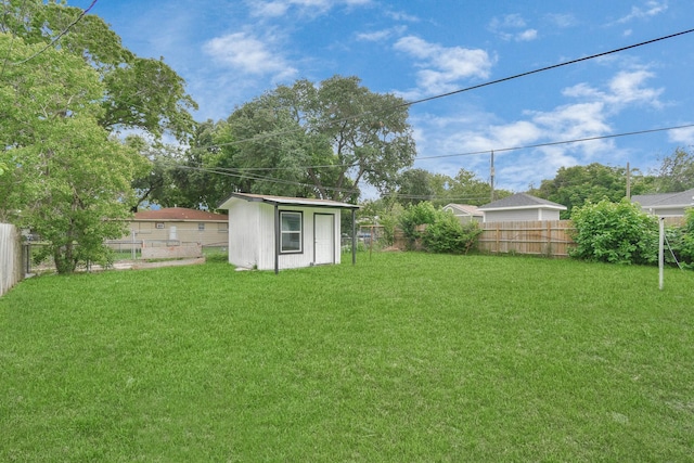 view of yard with a storage unit