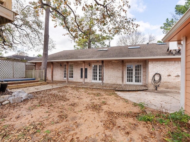 back of property featuring a patio and french doors