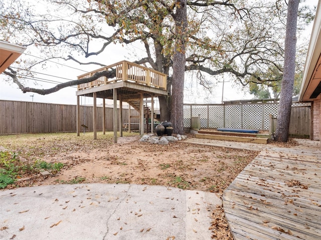 view of yard featuring a patio area and a deck