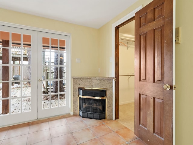 interior space with french doors and light tile patterned flooring