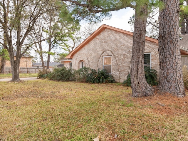 view of home's exterior with a yard