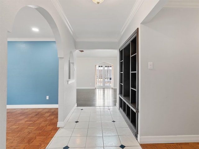 hall with crown molding, french doors, and light tile patterned floors