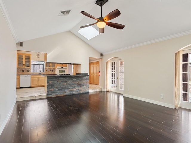 unfurnished living room featuring sink, wood-type flooring, high vaulted ceiling, and ceiling fan