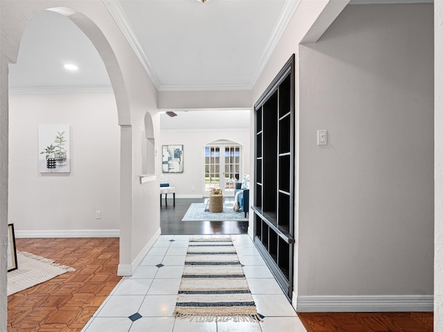 hall with ornamental molding and arched walkways