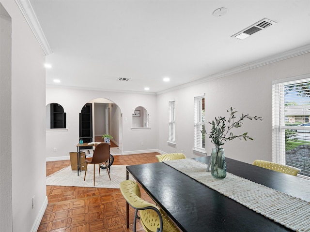 dining room with visible vents, recessed lighting, ornamental molding, and arched walkways
