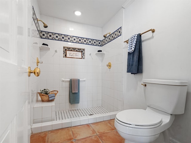 full bathroom with tile patterned floors, a tile shower, toilet, and recessed lighting