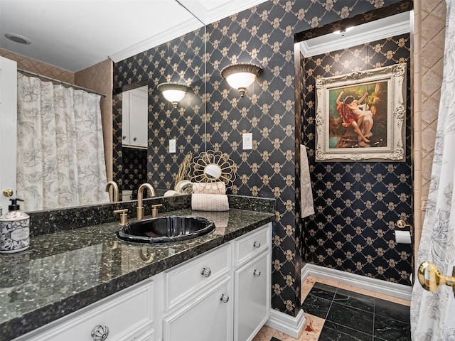 full bathroom with vanity, ornamental molding, and baseboards