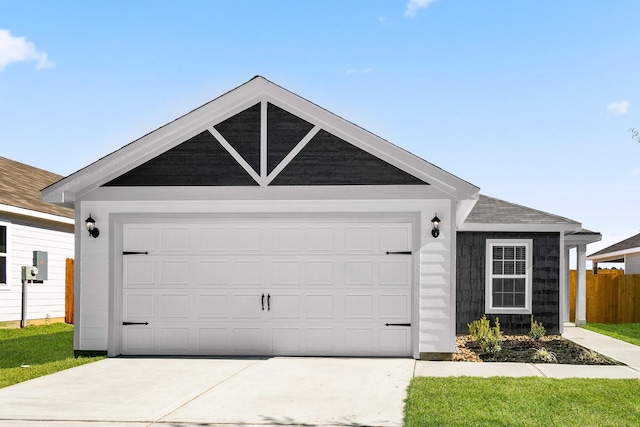 ranch-style house with a garage and a front lawn