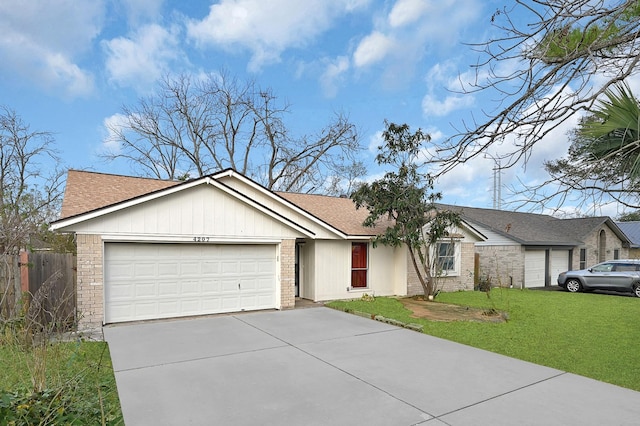 ranch-style house with a garage and a front lawn