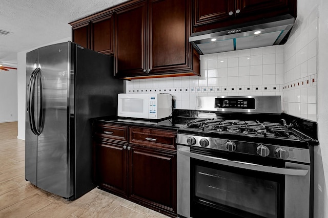 kitchen featuring wall chimney exhaust hood, ceiling fan, stainless steel appliances, and backsplash