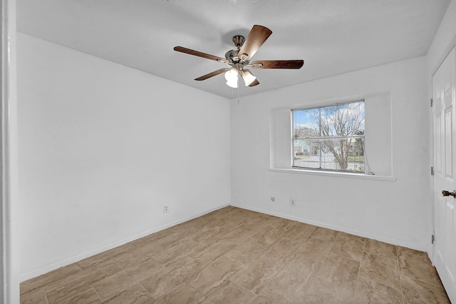 spare room featuring ceiling fan