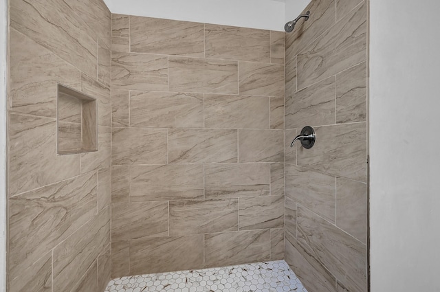 bathroom featuring tiled shower