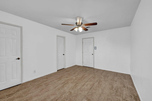 empty room featuring ceiling fan and light wood-type flooring