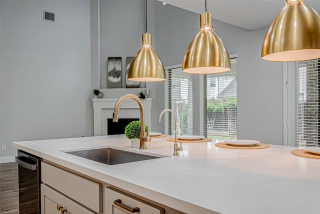 kitchen featuring dark wood-style flooring, a sink, visible vents, white cabinetry, and light countertops